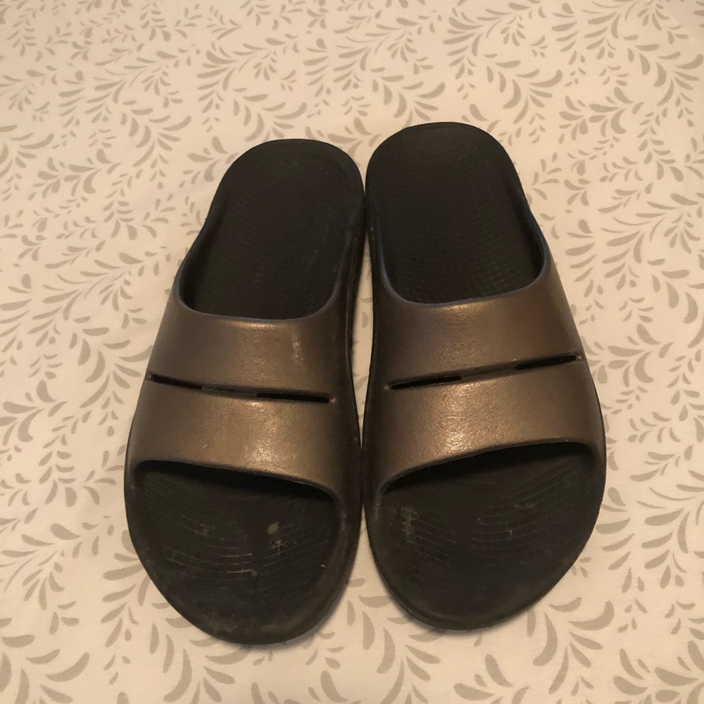 Oofos slides.